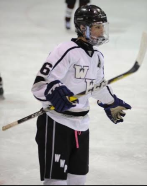 Ronan Keenan on the ice during a hockey match. 