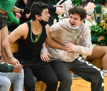 Seniors Luis Saldivia (left) and Shane Dowling (right) cheer after a point is scored