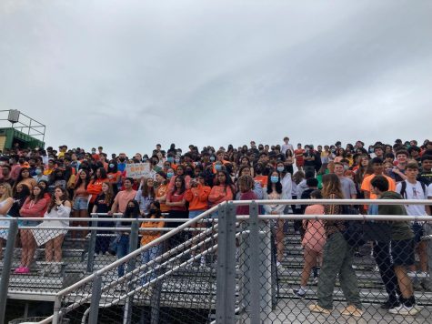 Students gather on the bleachers