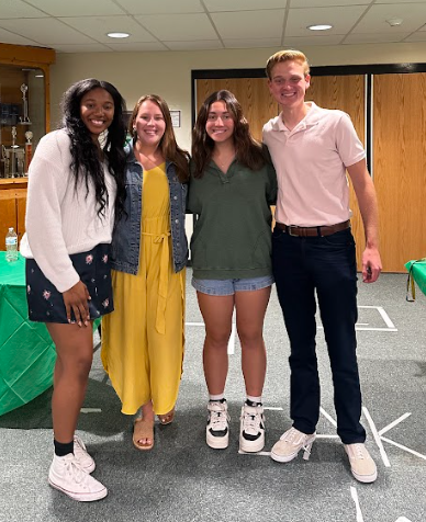Members of the varsity track program at the track banquet.
From left to right: Ashley Emerah (23), Coach Reilly, Solea Rubiano (24), Logan Snyder (23)