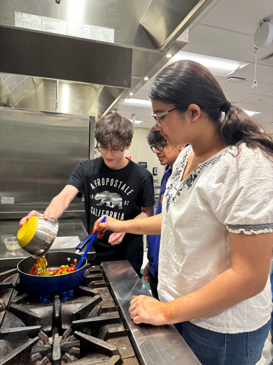 Culinary Arts students preparing vegetable fried rice.