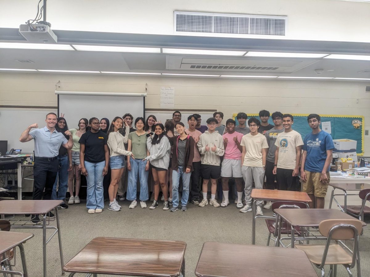 Mr. Brack posing with one of his former AP Lang classes in room 900a on the last day of school
