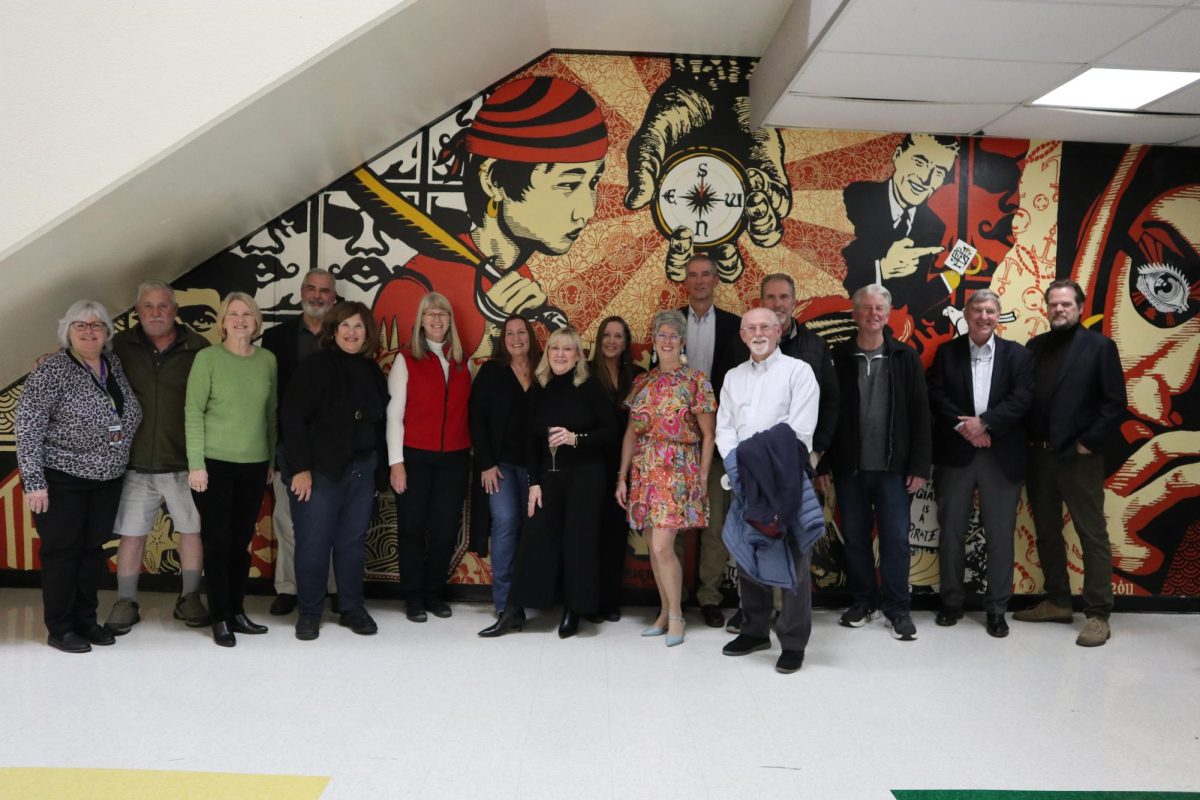 Former South faculty and alumni gathered where the phone booths once were.